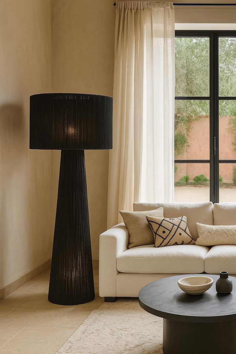 Handmade lamp made from braided rope or raffia