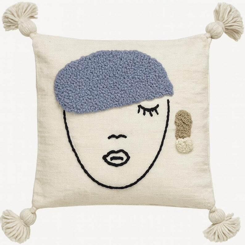 Embroidered face cushion