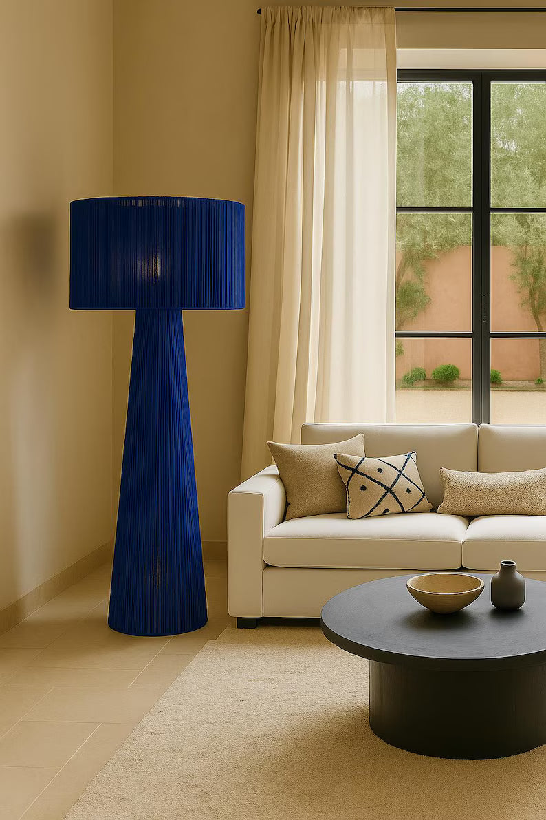 Handmade lamp made from braided rope or raffia