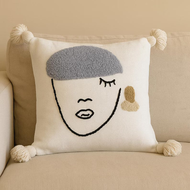 Embroidered face cushion
